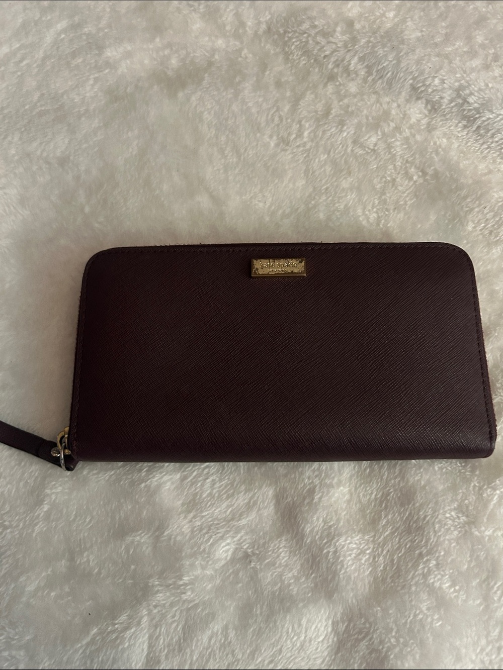 kate spade deep burgundy zip-around wristlet wallet